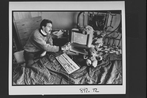 computer analyst john mcafee holding stethoscope to ibm type computer sitting on bed w ice bag on top, illustrating computer virus which mcafee is able to eradicate at home    photo by john storeygetty images