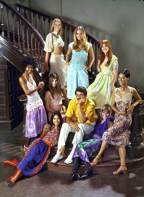 actor rock hudson c sitting on mgm lot w eight midi skirted starlets who play opposite him in pretty maids all in a row  photo by john doministhe life picture collection via getty images