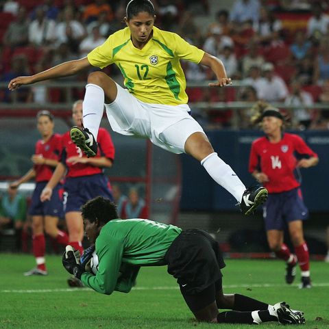 athens   august 26  goalkeeper briana scurry of the united states collects the ball while cristiane of brazil jumps to avoid her during the womens football gold medal match on august 26, 2004 during the athens 2004 summer olympic games at karaiskaki stadium in athens, greece photo by shaun botterillgetty images