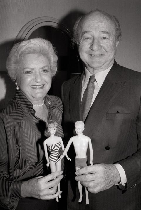 a portrait of ruth and elliott handler, the couple who introduced the barbie doll in 1959, holding a barbie and ken doll the couple will receive the lifetime achievement award from doll reader magazine
