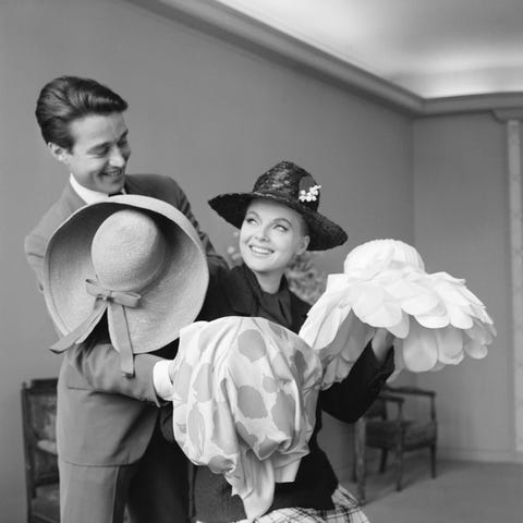 Halston and Actress with Hats fashion designer halston and italian film star virna lisi look at various hats