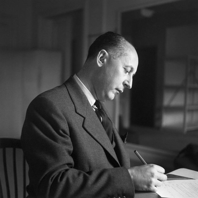 1950 portrait of french fashion designer christian dior 1905 1957 writing at his desk