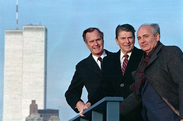 after a meeting in new york, president ronald reagan, vice president george herbert walker bush and soviet general secretary mikhail gorbachev pose with the world trade center in the background