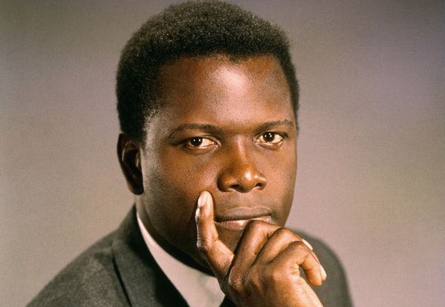 31966 hollywood, ca original caption reads close up photo of american actor sidney poitier, looking straight ahead with his hand wrapped around his chin