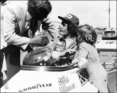an unlocated photo taken in 1974 shows gilles villeneuve c of canada being interviewed in his car as his son jacques r stands by photo credit should read afpafp via getty images