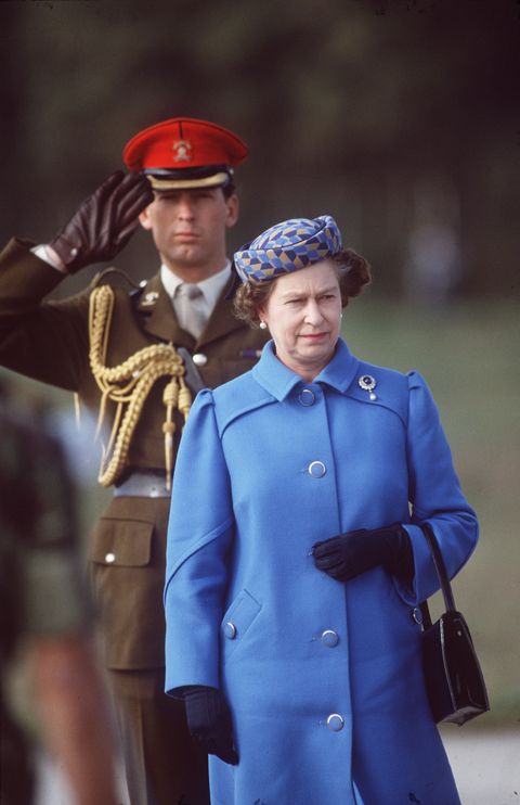 oporto, portugal march 29 the queen on an official tour of portugal major hugh lindsay, the queens squire stands behind her major lindsay was a friend of prince charles and princess diana and died in a ski accident while skiing with the prince photo by tim graham photo library via getty images