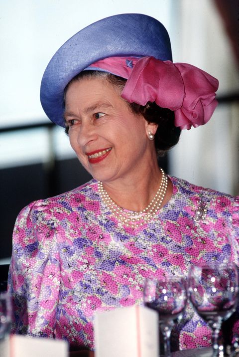 singapore   october 11  the queen wearing a hat designed by frederick fox at a luncheon at the national university of singapore, singapore  photo by tim graham photo library via getty images