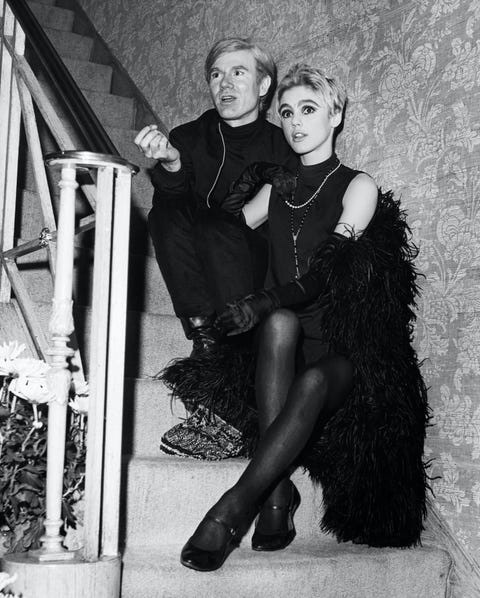 Andy Warhol and Actress Edie Sedgwick Seated on Stairs