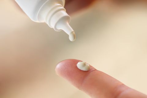 Putting cream from tube on finger