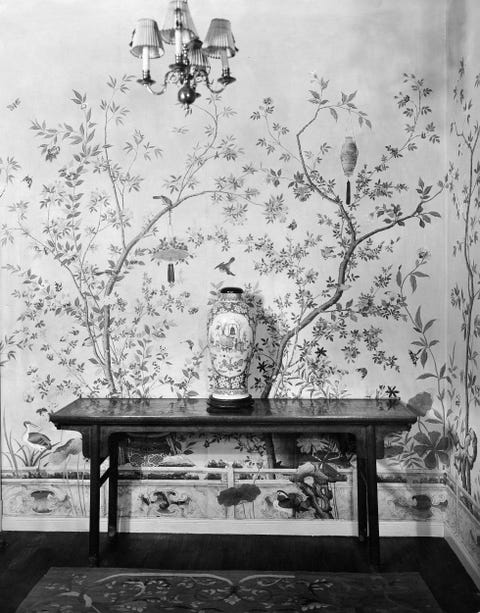chinoiserie anteroom with old chinese wallpapers as well as a chinese table