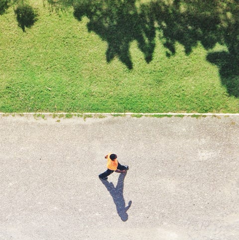 Man Walking On Park Alley