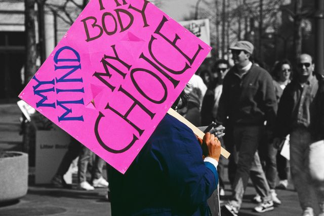 a pro choice march in washington, dc, 4th may 1992 one protestor carries a placard which reads 'my mind, my body, my choice'