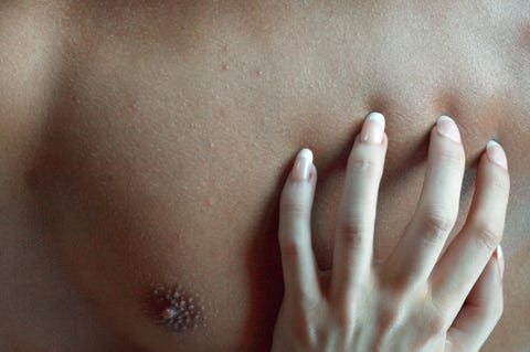 Woman touching mans chest pezones