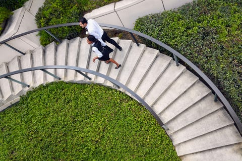 man and woman walking curve