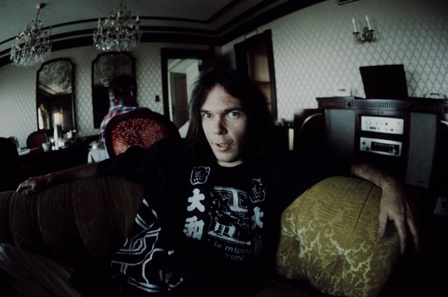 mandatory credit koh hasebeshinko musicgetty images neil young in happi coat relaxing at a hotel, tokyo, march 1976 photo by koh hasebeshinko musicgetty images