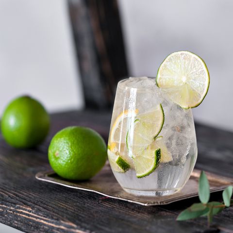 Cold cocktail with lime, lemon, tonic, vodka and ice