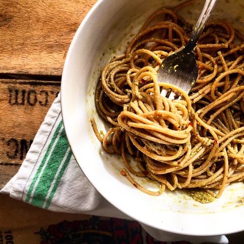 Spaghetti in bowl with rustic background