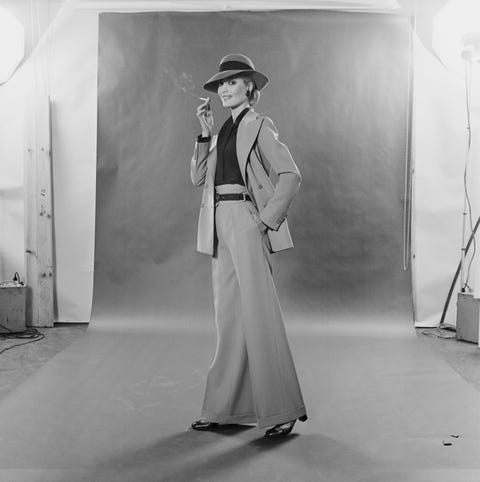 Hat, Standing, Monochrome, Vintage clothing, Monochrome photography, Black-and-white, Costume design, Retro style, Sun hat, Fashion design, 