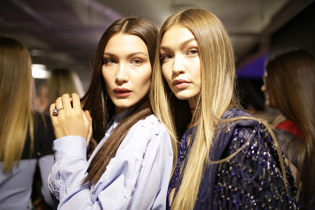 milan, italy september 23 bella hadid and gigi hadid backstage at the versace ready to wear show during milan fashion week springsummer 2017 on september 23, 2016 in milan, italy photo by victor virgilegamma rapho via getty images