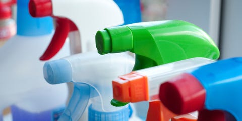 Close-Up Of Spray Bottles In Kitchen