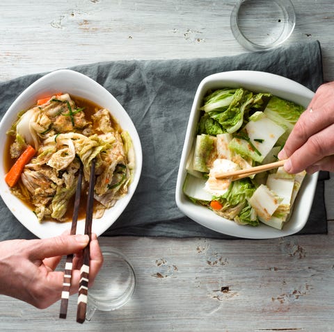 eating kimchi on the white wooden table top view horizontal