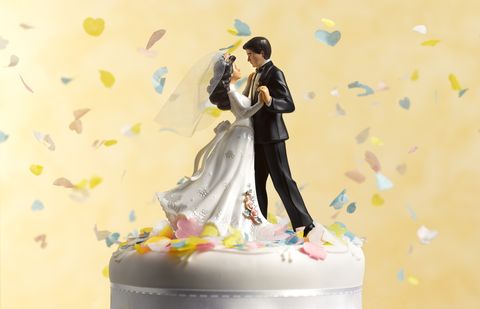 White, Yellow, Figurine, Wedding cake, Toy, Wedding ceremony supply, Action figure, Cake decorating, Fictional character, Flower, 