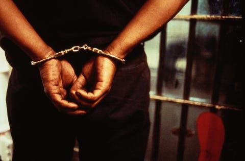 Handcuffed Prisoner ERIKA KYTE GETTY IMAGES