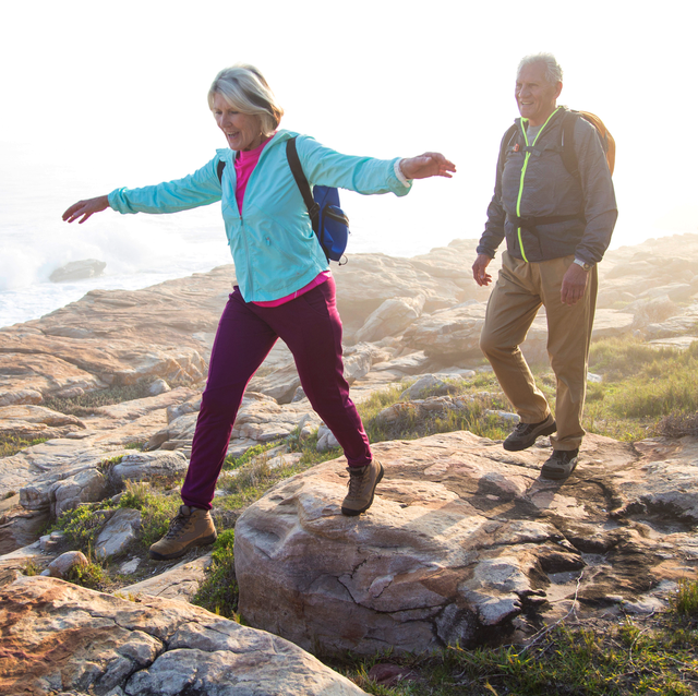 older couple hiking near the coast