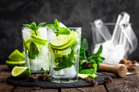 Refreshing mint cocktail mojito with rum and lime, cold drink or beverage with ice