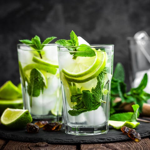 Refreshing mint cocktail mojito with rum and lime, cold drink or beverage with ice