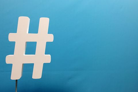Hashtag Sign Against Blue Background