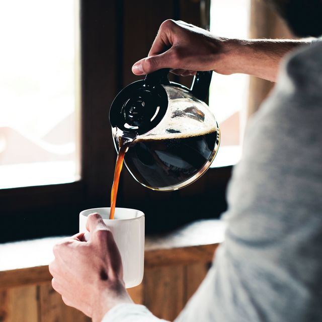 man pouring coffee