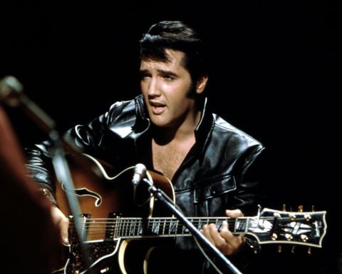 Rock and roll musician Elvis Presley performing