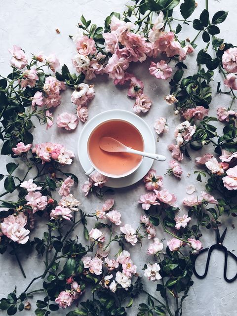 Cup of herbal tea with dried roses