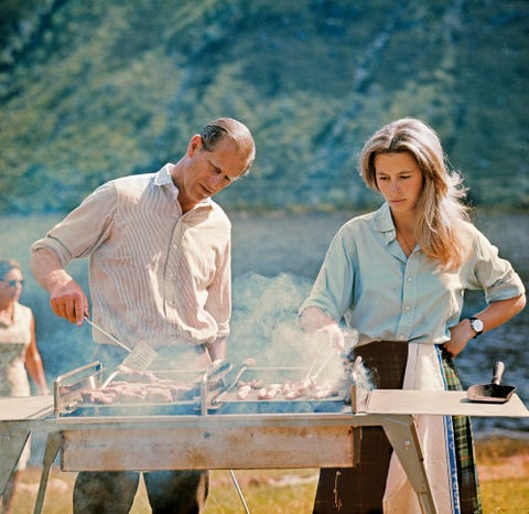 AUGUST 22, 1972 Prince Philip barbecues as daughter Princess Anne assists during the royal family’s summer holiday at Balmoral Castle, in the Scottish Highlands. august 22, 1972
prince philip barbecues as daughter princess anne assists during the royal family’s summer holiday at balmoral castle, in the scottish highlands