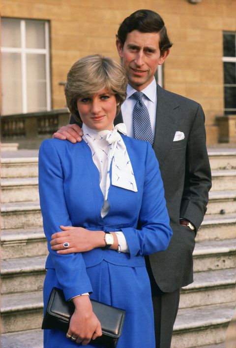 great britain   february 24  lady diana spencer later to become princess of wales reveals her sapphire and diamond engagement ring while she and prince charles, prince of wales pose for photographs in the grounds of buckingham palace following the announcement of their engagement  photo by tim graham photo library via getty images