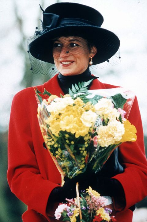 united kingdom   december 25  princess diana at sandringham on christmas day, the princess is wearing a red coat and a broad brimmed black hat, she is carrying a bouquet of flowers  photo by tim graham picture librarygetty images