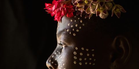 Karo tribe child with flowers decorations, Omo valley, Korcho, Ethiopia