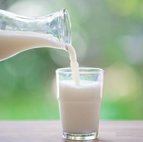 Milk bottle pouring to glass