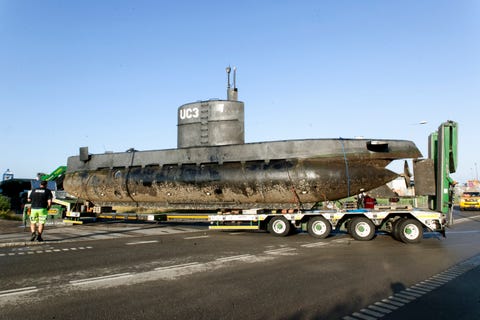 Submarine Towed To Copenhagen Harbor copenhagen, denmark august 13 the privately owned submarine, nautilus, which is the suspected crime scene for the assumed murder on swedish journalist kim wall, is carried out of copenhagen harbor on a truck for further forensic police investigation taking place near the harbor on august 13, 2017 in copenhagen, denmark the submarine sailed out of copenhagen harbor thursday evening with owner peter madsen and kim wall onboard later the submarine sank in 8 meters water peter madsen was safely rescued but the swedish journalist was missing and madsen was subsequently arrested by the police and charged for murder madsen claimed that the woman was put ashore before the submarine sank madsen appeared for a preliminary examination at the copenhagen court saturday afternoon police are now to investigate the submarine, which is built by madsen himself the swedish journalist is still being searched for by the police her identity was released saturday by her family to danish broadcaster tv2photo by ole jensen corbiscorbis via getty images