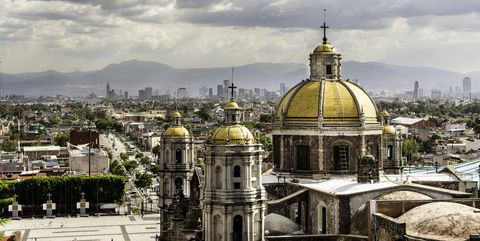 Guadalupe Basilica church and Mexico City skyline