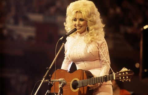 united kingdom  american singer, songwriter and actress dolly parton, performs with a guitar, 1976 photo by david redfernredferns