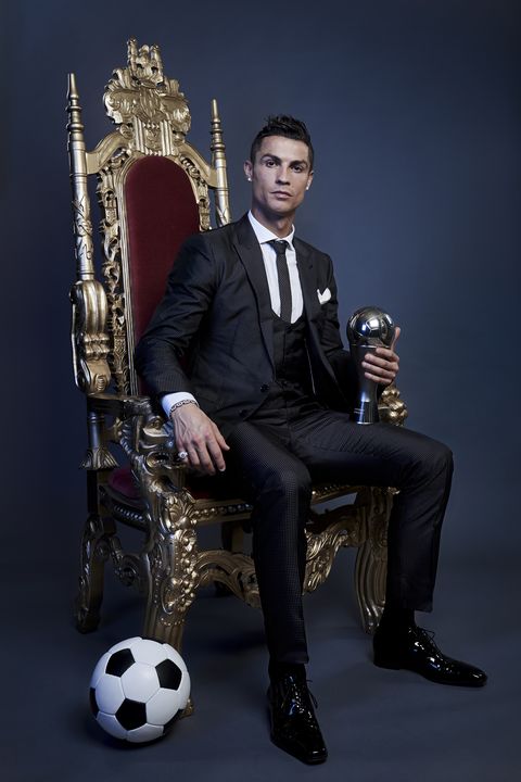 suit, sitting, formal wear, photography, photo shoot, musician, tuxedo, chair, musical instrument, ball,