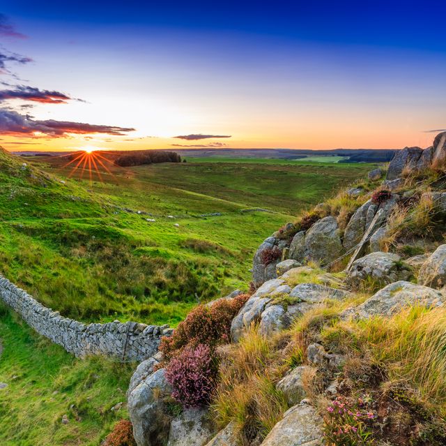 sunset at hadrians wall in northumberland, england