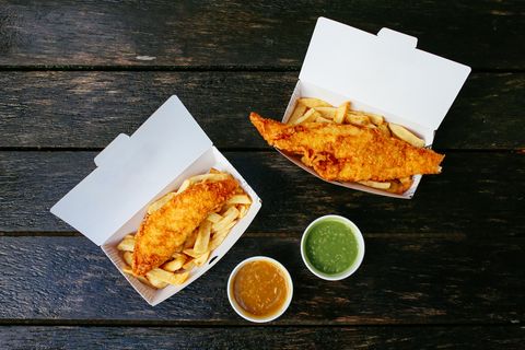 Fish and chips on the wooden table