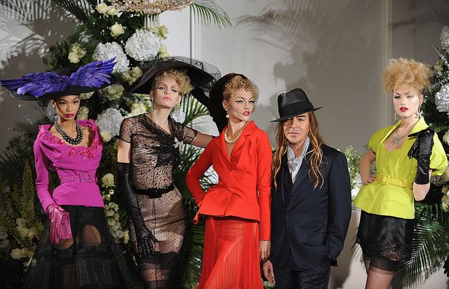paris   july 06  fashion designer john galliano 2nd r poses with models during the christian dior haute couture fashion show for aw 200910 on july 6, 2009 in paris, france  photo by pascal le segretaingetty images