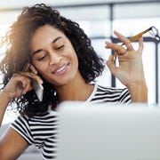 Contacting and connecting with who I need shot of a young woman working from home