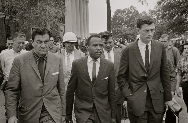 united states    1962  james meredith walking to class accompanied by us marshals and lawyer john doar right  photo by buyenlargegetty images