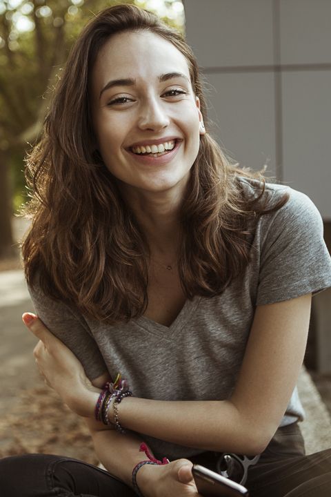 Portrait of happy young woman outdoors