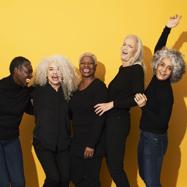 Portrait of five women laughing and having fun